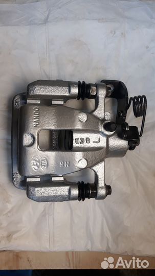 Суппорт задний левый Kia Rio 3