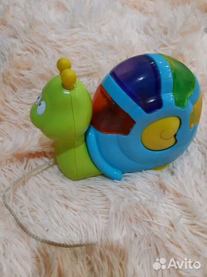 Каталка-игрушка. Улитка на колёсиках свет.-муз