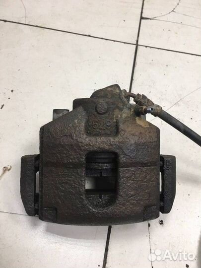 Суппорт тормозной передний левый Ford Fusion