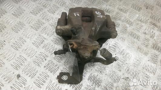 Суппорт тормозной задний правый toyota avensis T27