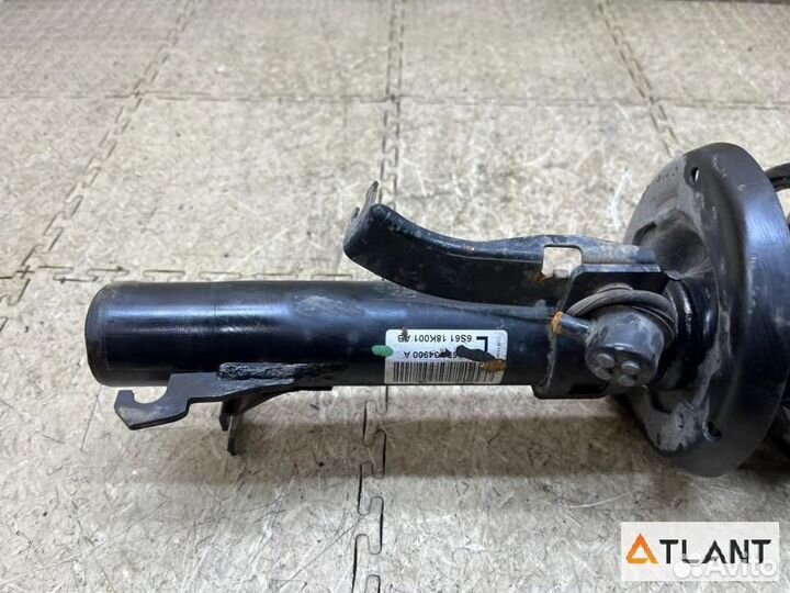 Стойка передняя левая mazda demio