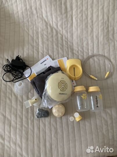 Молокоотсос medela электрический