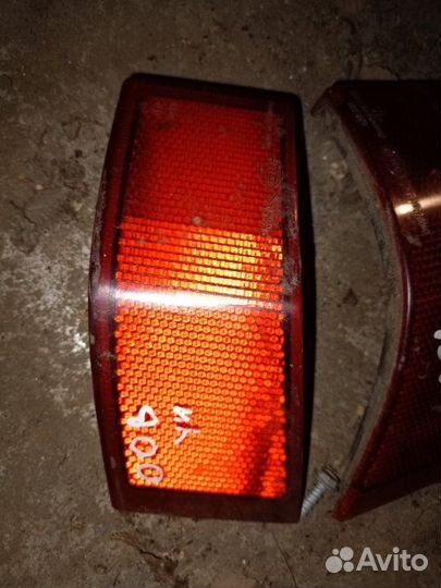 Отражатель в бампер задний Opel Omega универсал