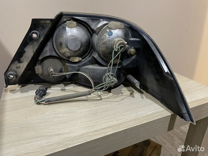 Фонарь левый Mitsubishi Lancer / Cedia (00-03)