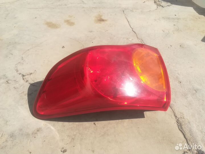 Фонарь правый внешний Toyota Corolla E150