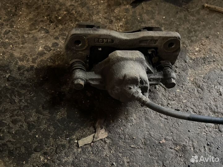 Суппорт передний девый на kia spectra