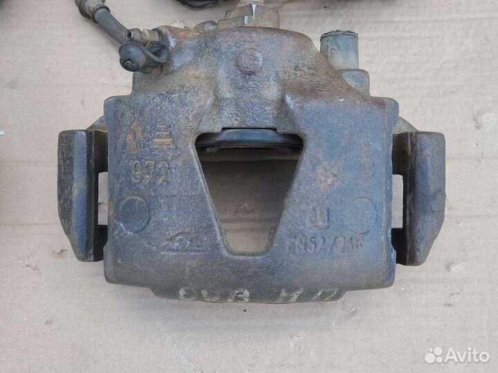 Суппорт передний левый (правый) Opel Vectra B