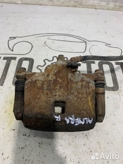 Суппорт передний правый Nissan Almera Classic B10