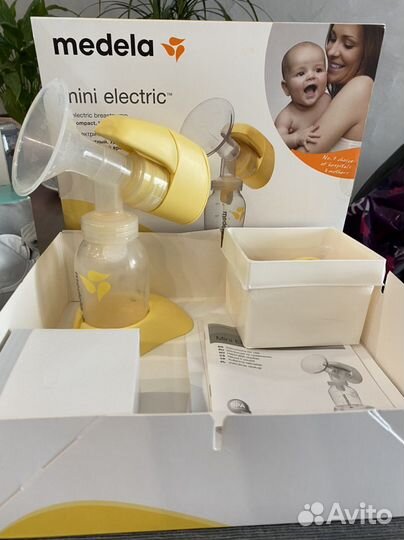Молокоотсос medela электрический