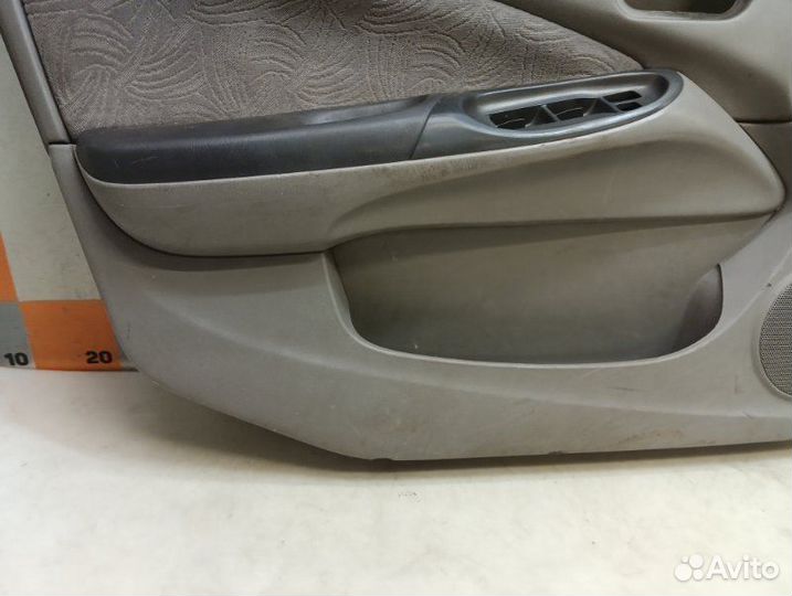 Обшивка двери передняя левая Nissan Almera N16 1.8