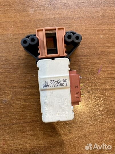 Устройство блокировки люка стиральной машины