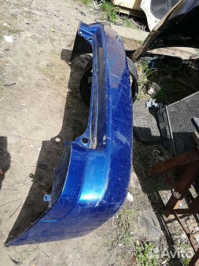 Бампер задний Мазда Демио 1