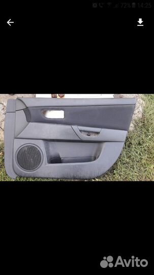 Обшивка двери мазда 3