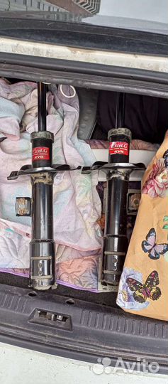 Передние стойки лансер10