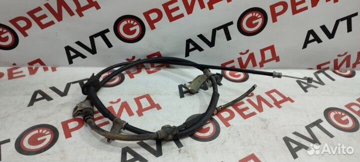 Тросик ручного тормоза левый Mitsubishi Airtrek