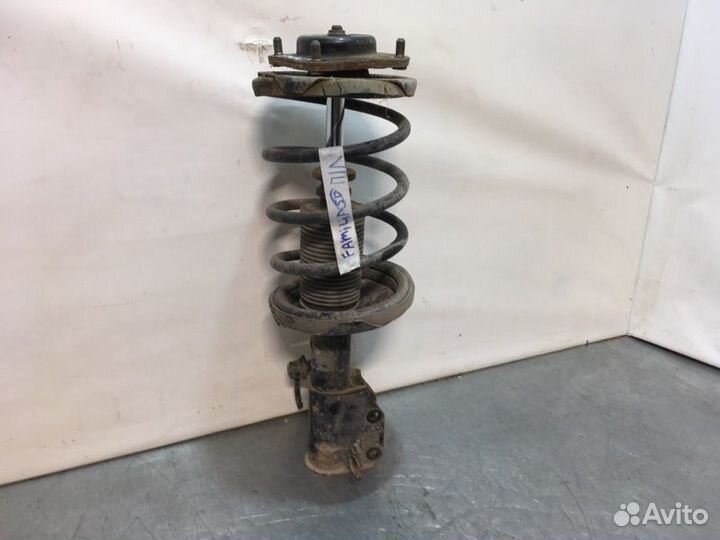 Стойка подвески передняя левая Mazda Familia седан