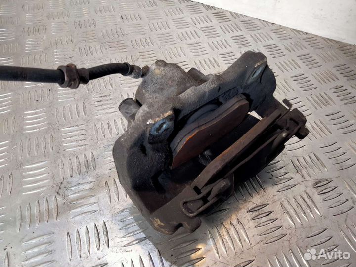 Суппорт передний левый Опель Зафира А