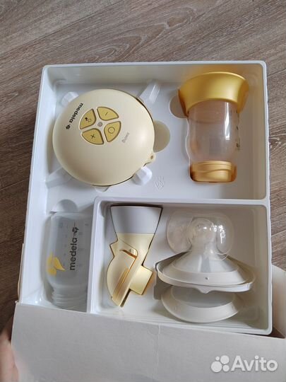 Молокоотсос medela электрический