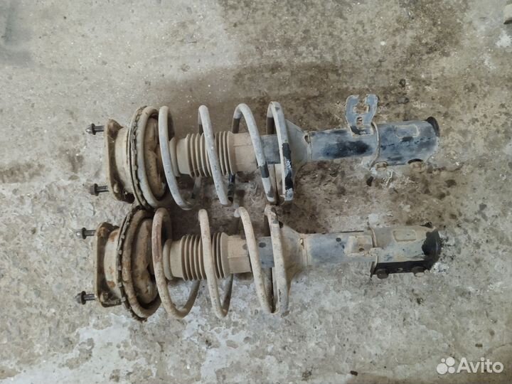 Стойки передние Мазда 626 GD