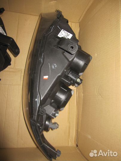 Фара левая Nissan Almera N16E оригинал новая