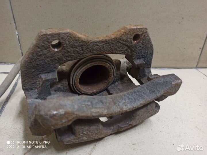 Передний суппорт левый Nissan Almera N16 2002-2006