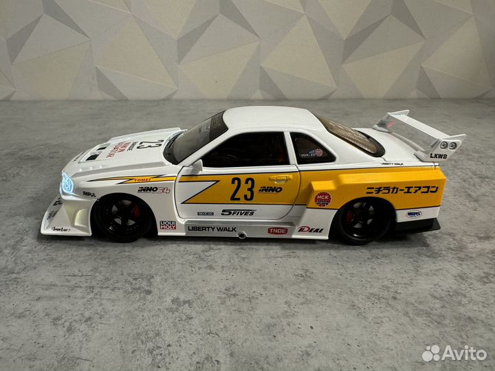 Модель авто Nissan Skyline GT-R R34 lbwk 1:24