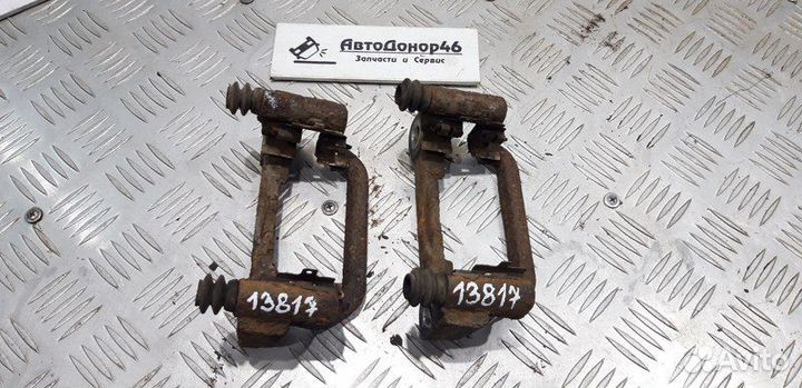 Скоба заднего суппорта Nissan Tiida C11