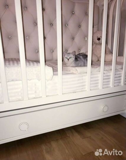 Детская кроватка с продольным маятником