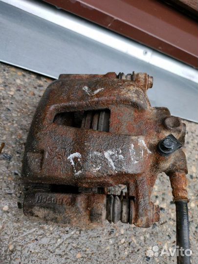 Суппорт тормозной передний правый Fiat Doblo