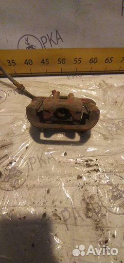 Суппорт тормозной задний левый Chevrolet Lacetti