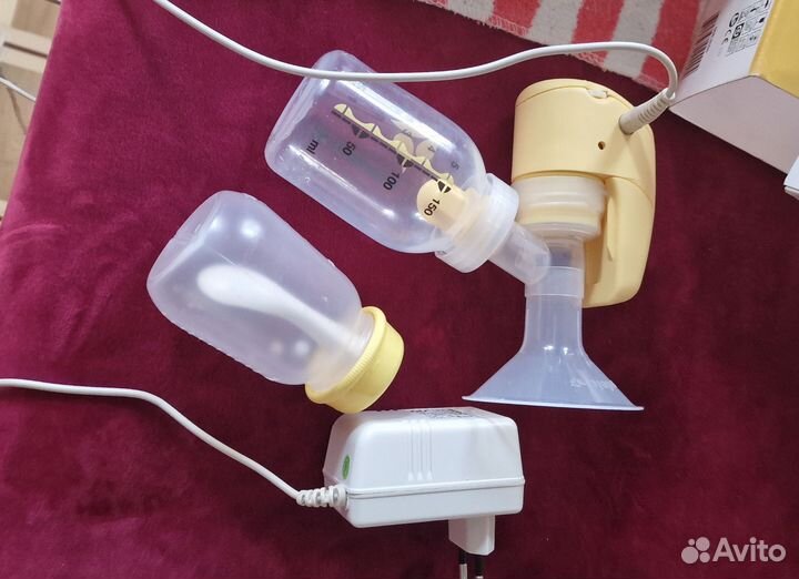 Молокоотсос medela электрический