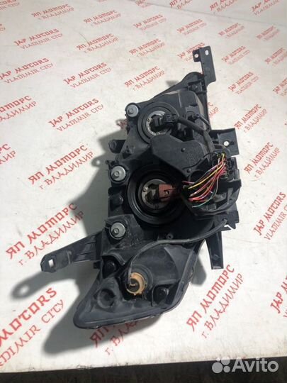 Фара галогеновая левая Mitsubishi Outlander XL