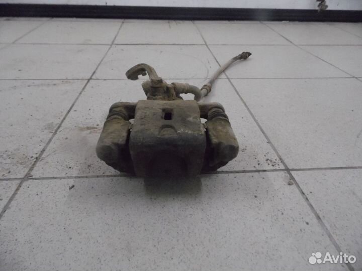 Суппорт тормозной задний левый Hyundai Elantra 200