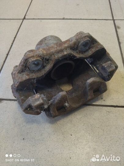 Суппорт тормозной передний левый Volkswagen Polo