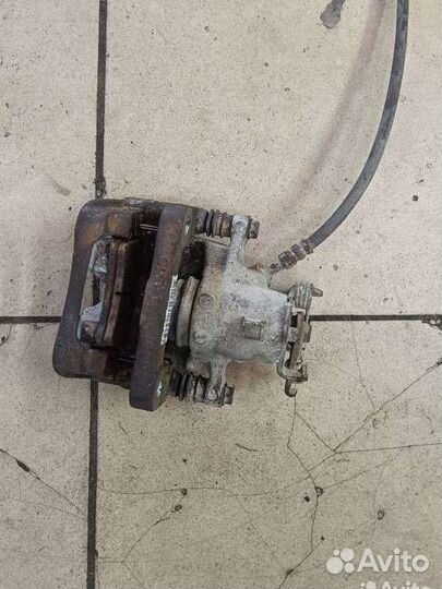 Суппорт тормозной задний левый Opel Insignia A