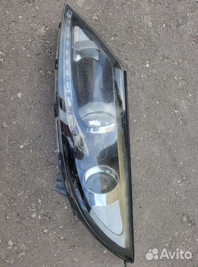 Фара головного света KIA Sportage 3 Левая оригинал