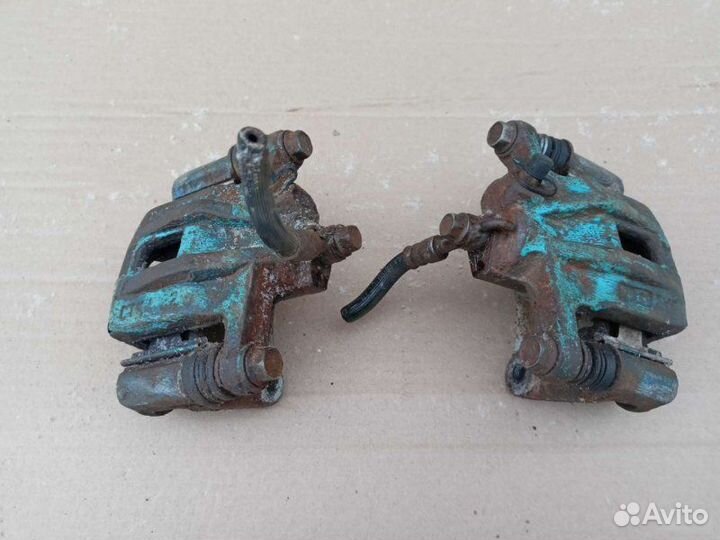 Суппорт тормозной задний левый Chevrolet Lacetti