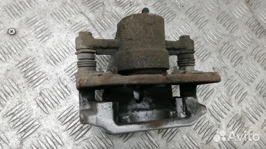 Суппорт тормозной задний левый toyota avensis T25