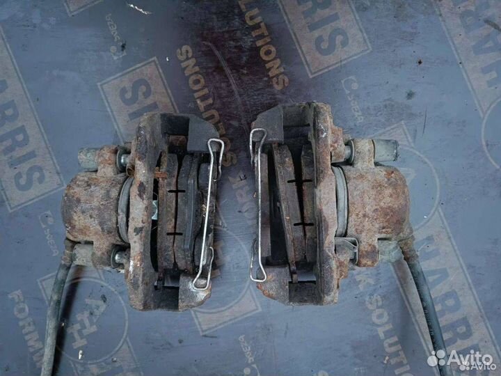 Суппорт тормозной передний левый Kia Shuma