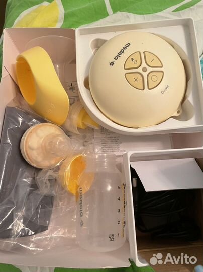 Молокоотсос medela электрический