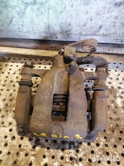 Суппорт тормозной задний правый Kia Rio