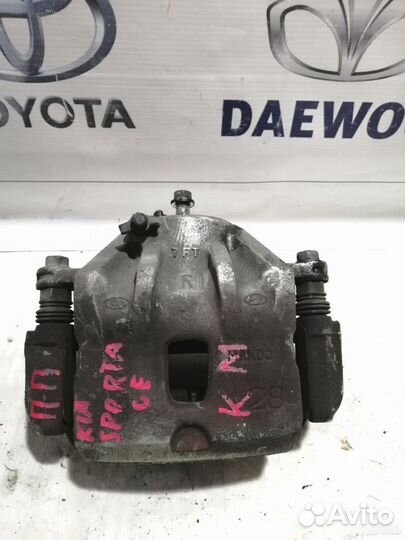 Суппорт тормозной передний Kia Sportage 2 KM