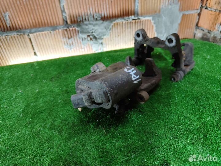 Суппорт задний левый Volkswagen Passat B6