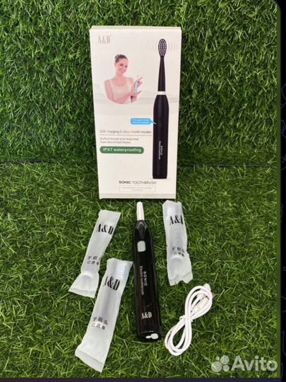 Электрическая зубная щетка