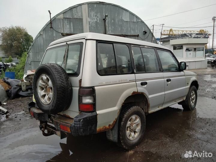 Суппорт задний левый 4m40 Mitsubishi Pajero 2.8
