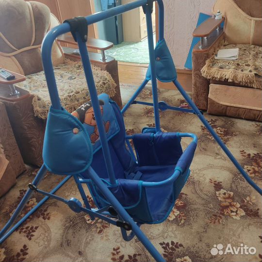 Детские качели и велосипед