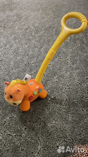 Игрушка каталка с ручкой