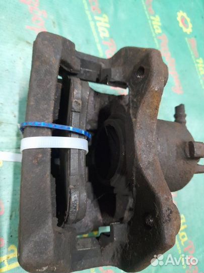 Суппорт передний левый Nissan Almera N16 хечбэк