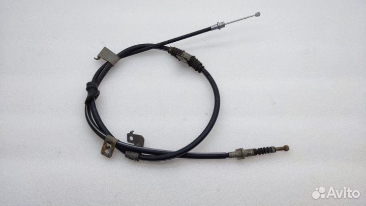 Трос стояночного тормоза левый Mitsubishi