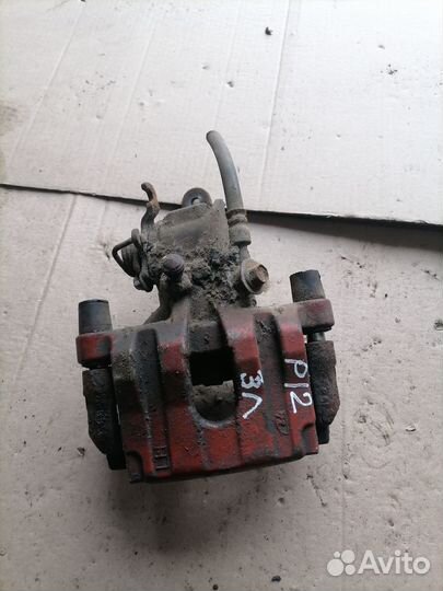 Суппорт Nissan Primera P12 задний левый